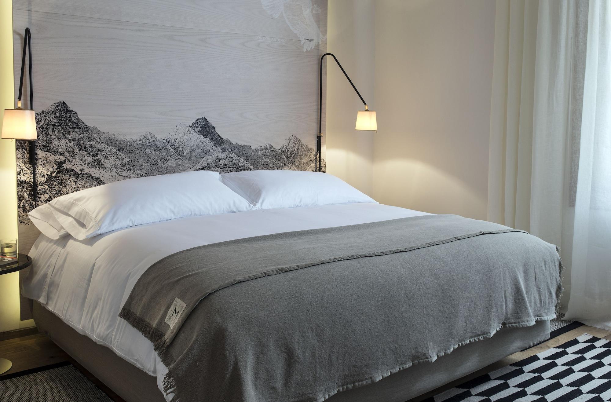 Hotel Magnolia Santiago Exterior foto A bed with a throw